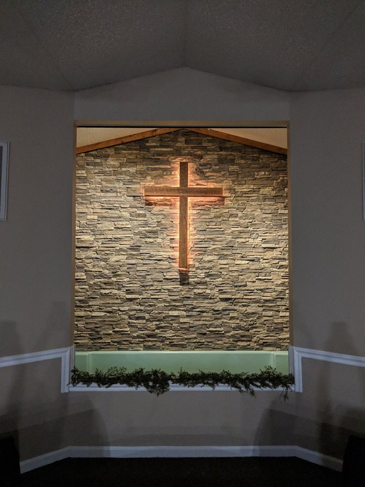 Church sanctuary wall renovated with Norwich Stacked Stone panels in Birchwood color.