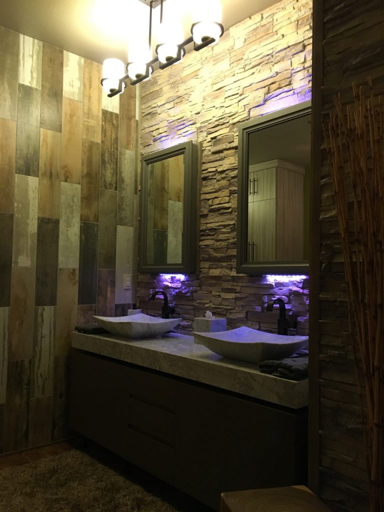 Master bathroom vaniety with LED lights behind the his and hers mirrors