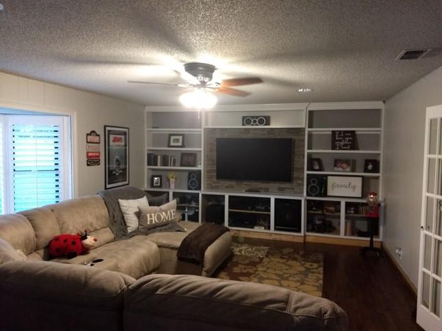 AFTER: Living room transformed, with plenty of natural light still coming in through the other window.
