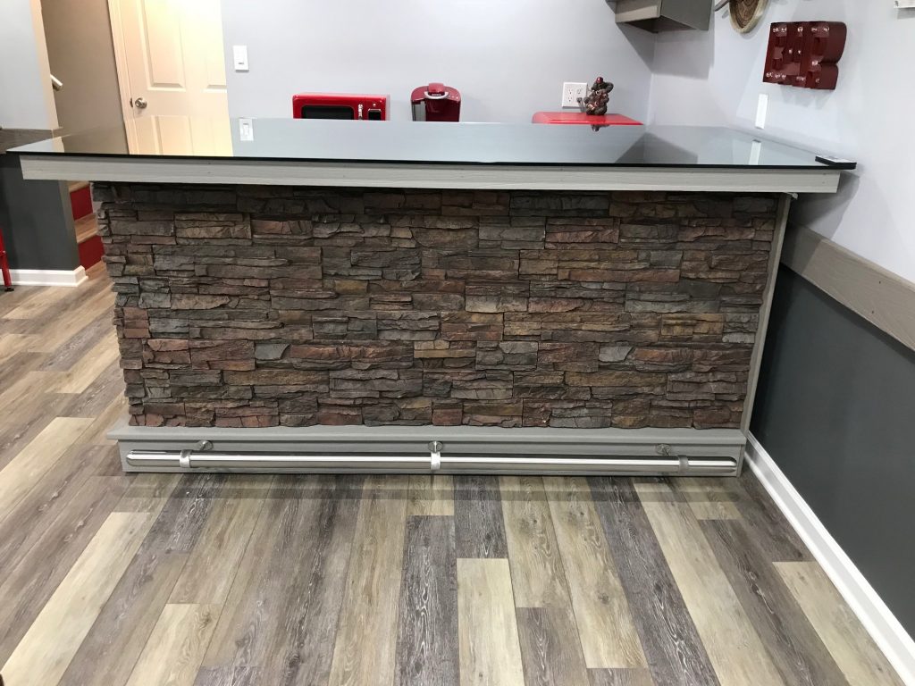 Basement bar built by the homeowner, finished a stacked stone veneer.