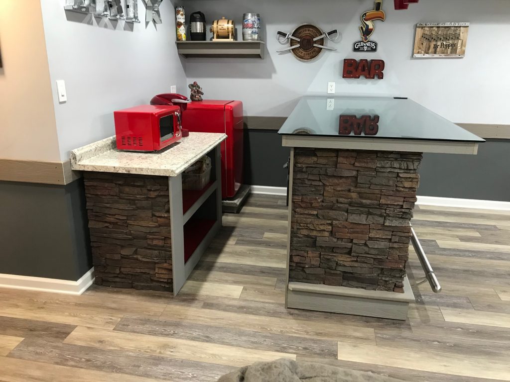 Home bar and cabinet finished with stone style paneling.