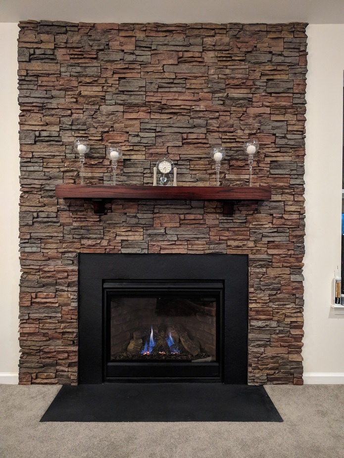 Fireplace finished with Norwich Stacked Stone panels.