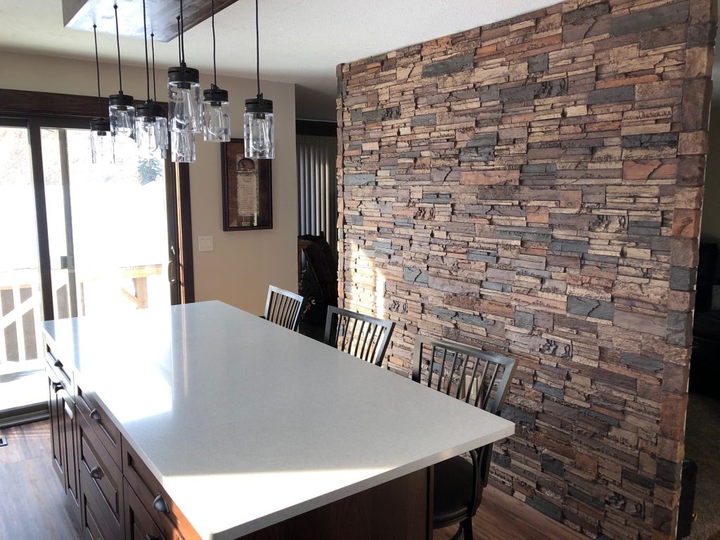 Stone-style kitchen accent wall created with lightweight Norwich Dry Stack panels.