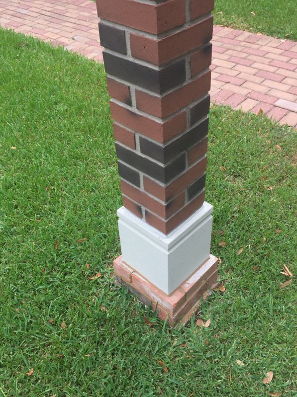 Close-up view of lamp post covered with Carlton faux brick.