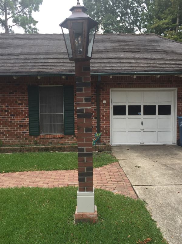 Driveway lamp post clad with a Carlton Brick post cover.