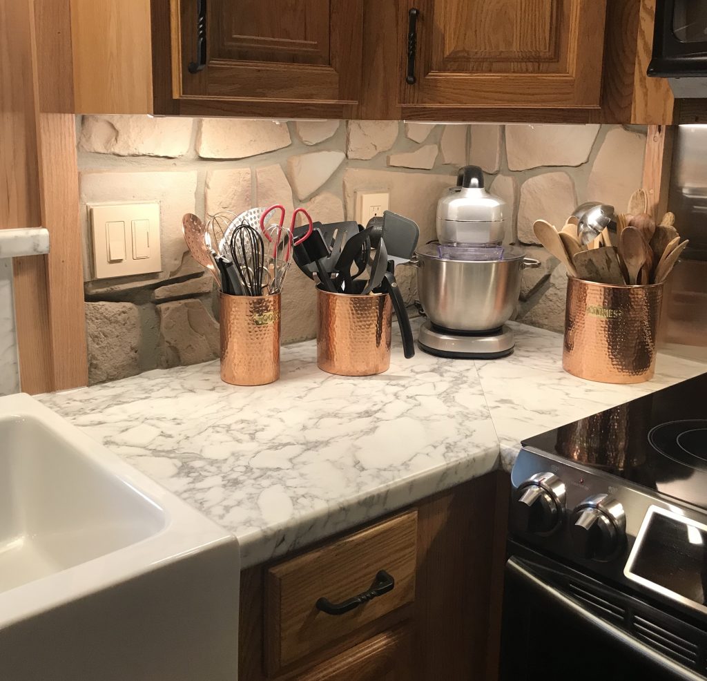 Creating this backsplash with faux Fieldstone was more practical and cost-effective than using real stone.