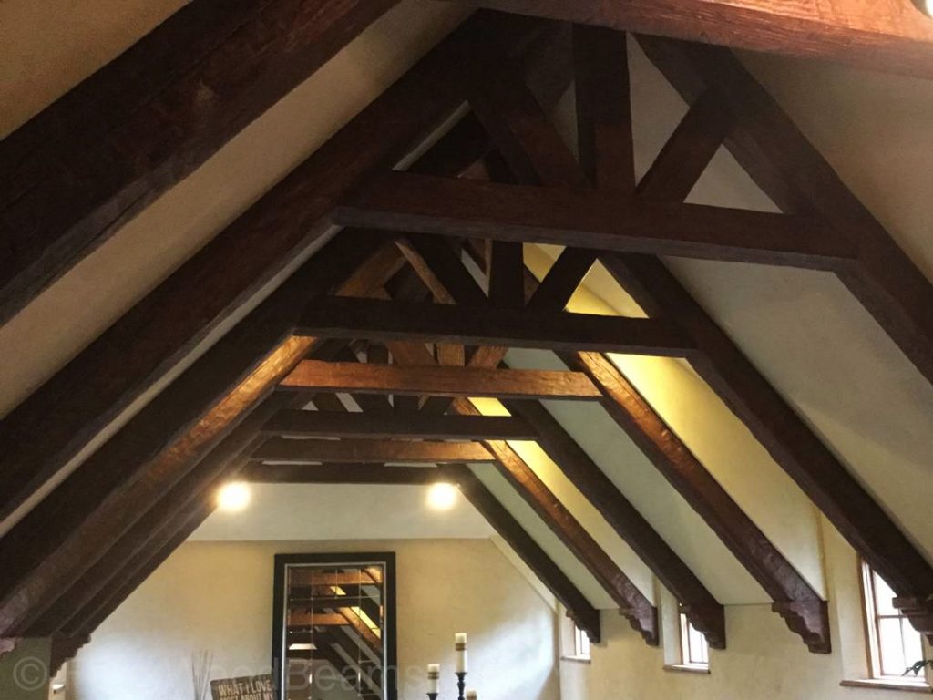 Corbels placed on the ends of a decorative truss.