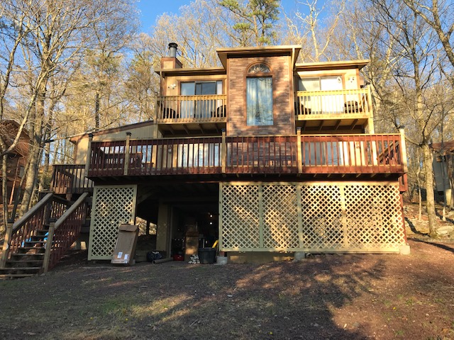 Stilt house in central New York State remodeling with Nailon Stone Wall Siding.