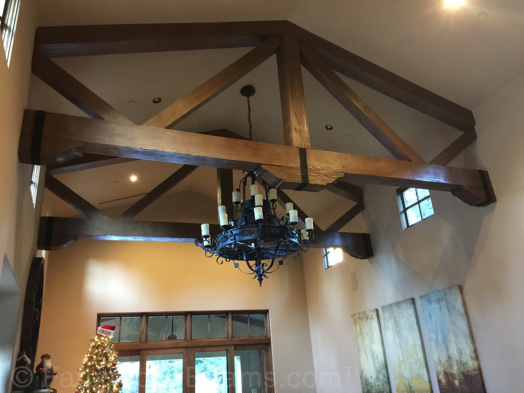 Corbels and accessory beam straps compete the look of these elegant trusses.