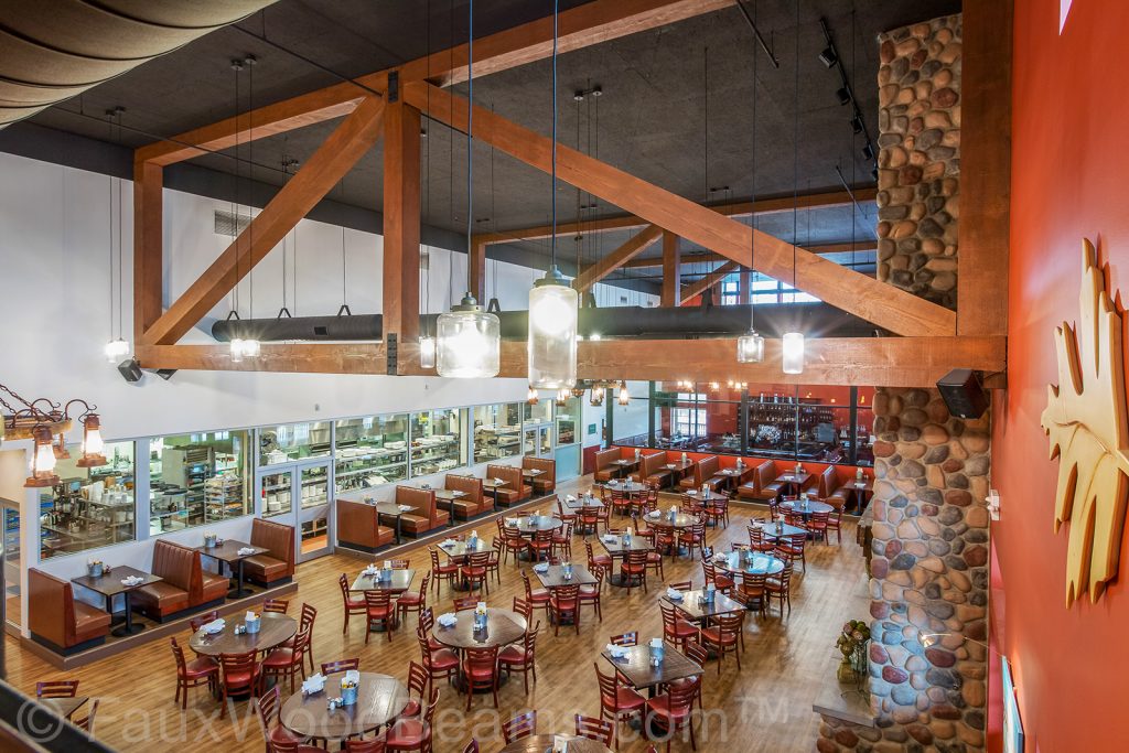 Ceiling trusses built with faux wood beams and Fair Oak Farms Farmhouse Restaurant.