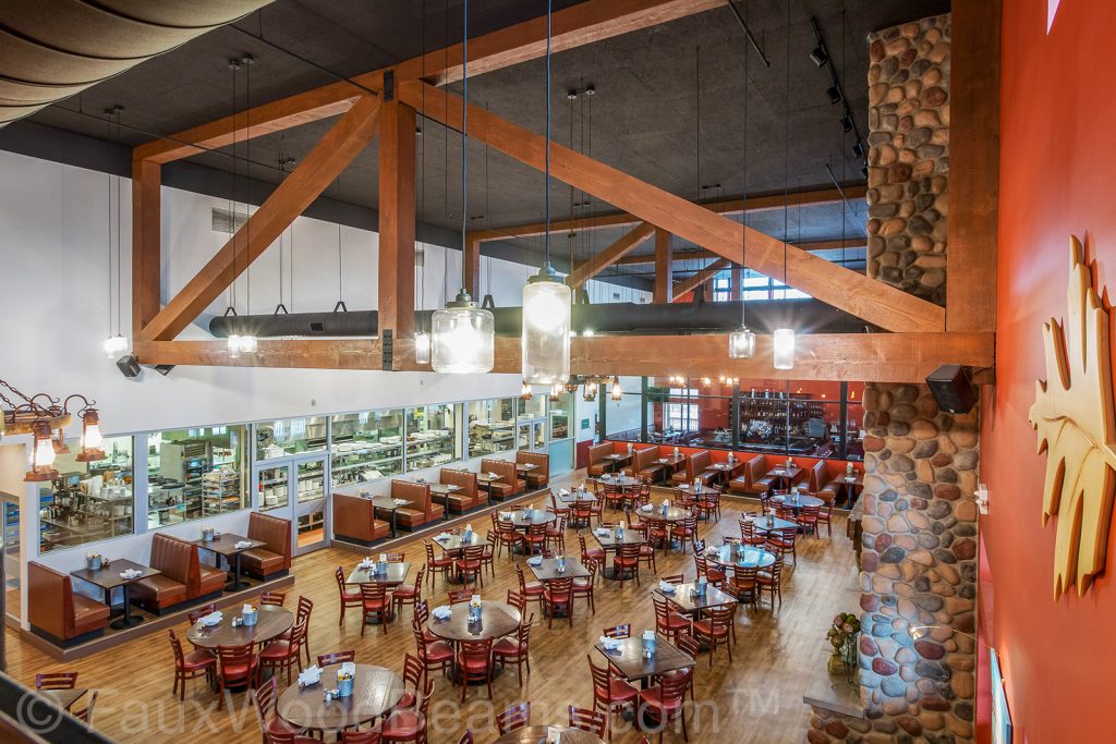 Ceiling trusses built with faux wood beams and Fair Oak Farms Farmhouse Restaurant.