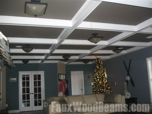 Basement ceiling with a coffered design created with smooth Regular beams.