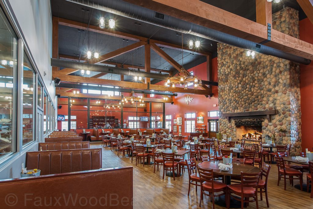 The sustainable interior design of Fair Oaks Farmhouse Restaurant included large ceiling trusses built with Custom Rough Sawn beams.