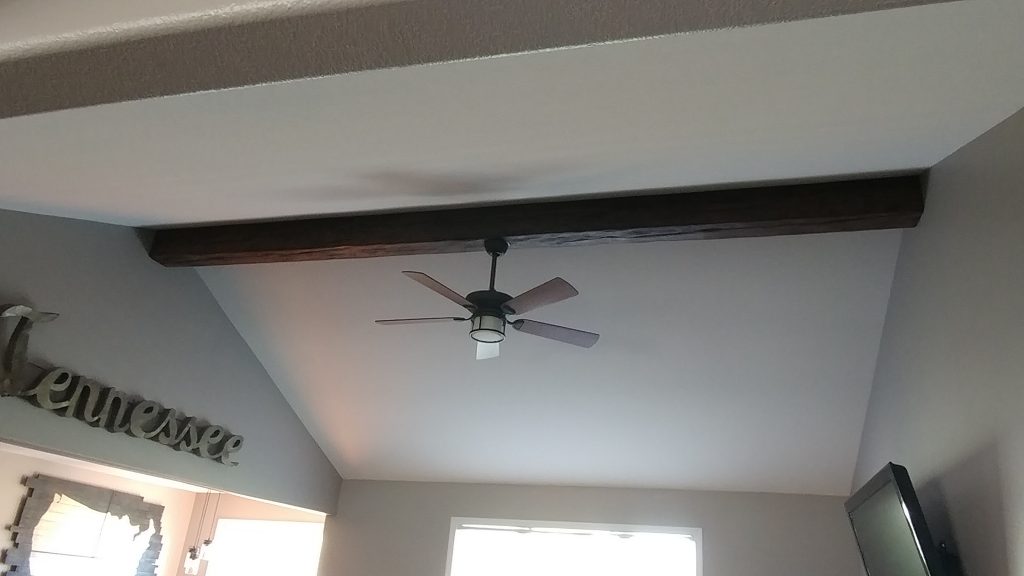 Family room beam with ceiling fan