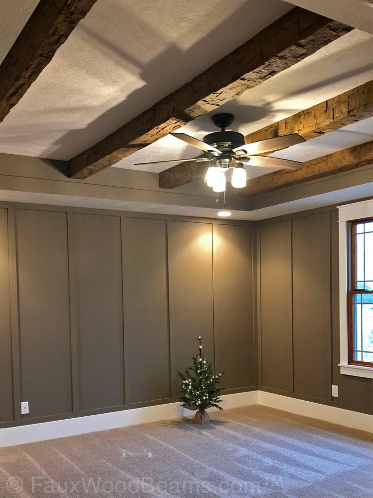 Rough Hewn Beams add a rustic accent to a bedroom ceiling.