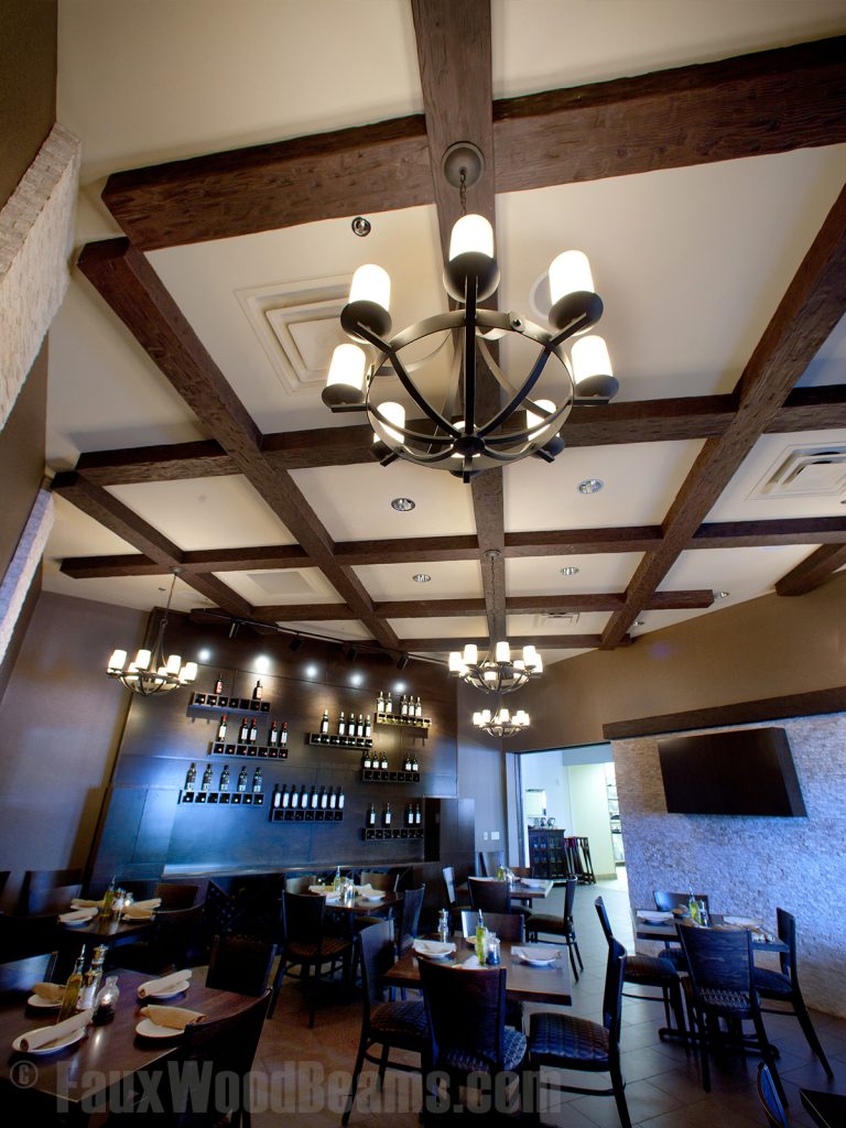 Restaurant ceiling with cross beams and chandeliers