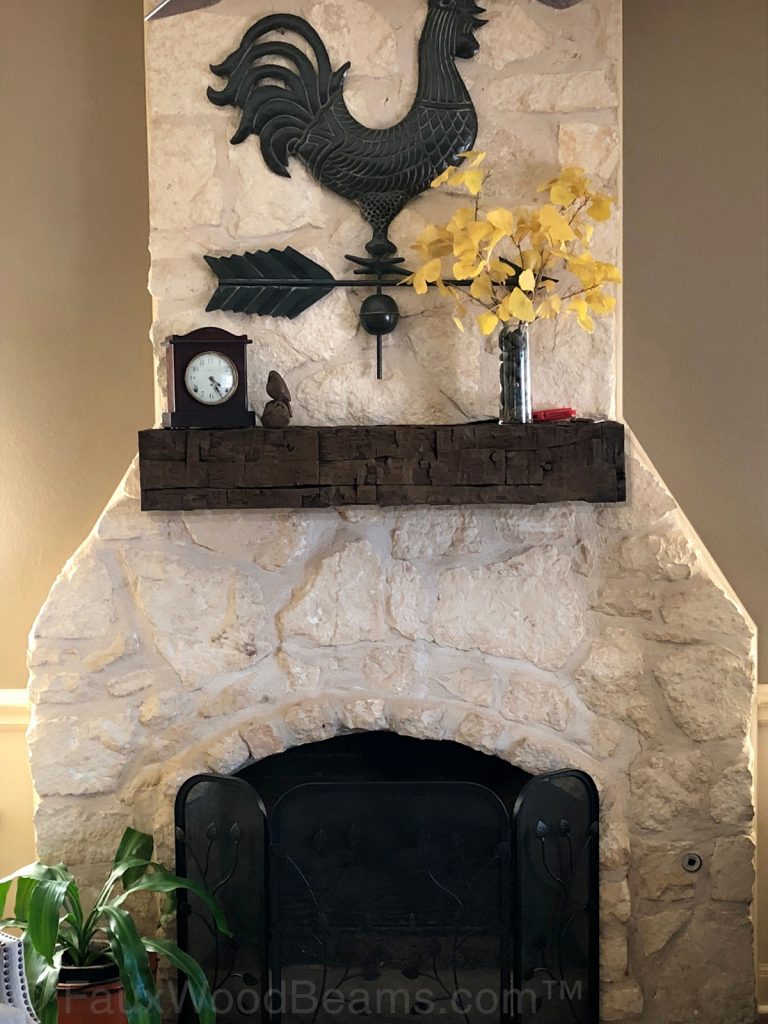 Hand Hewn mantel on a rustic farmhouse fireplace