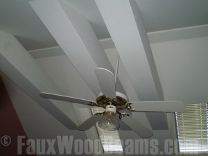 Painted beams maximize use of a room's natural light sources