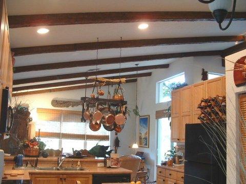 Correctly spaced faux ceiling beams in a kitchen remodeling project