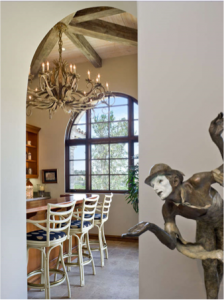 Weathered wood look created with faux beams, installed in a star-shaped configuration in the dining room.