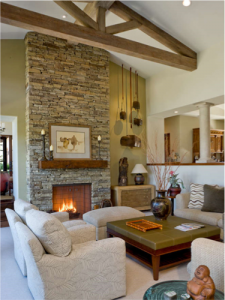An elegant weathered wood truss livens up a living room ceiling