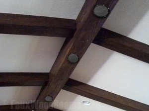 Housing surround sound speakers in hollow beams allows you to hide unsightly wires and cables.