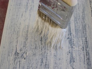 Drybrushing is the reverse of traditional staining so you'll be painting the raised areas instead of creating pools of stain in the recessed portions.
