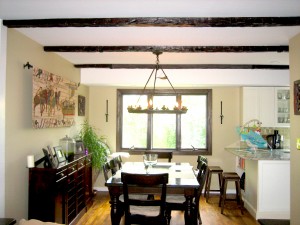 Bringing a unified design to life in your home can be simple when staining faux wood beams to complement existing fixtures.