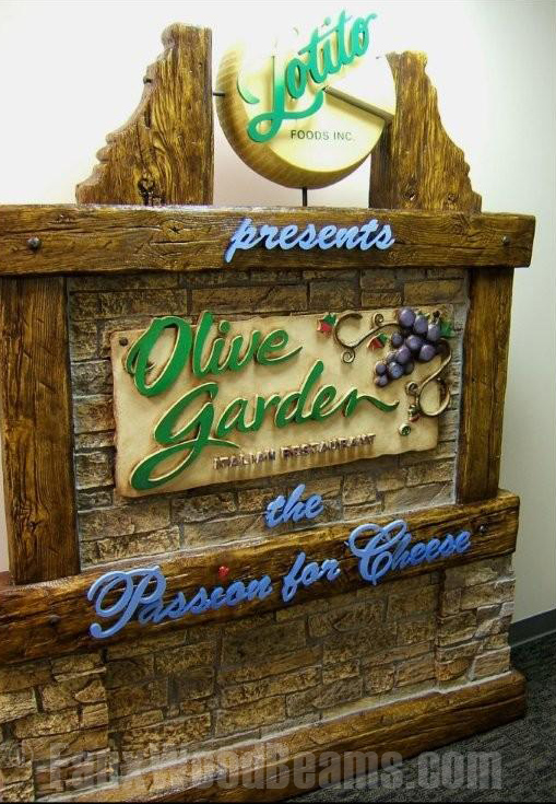 Timber beams accecnt a rustic Olive Garden sign that perfectly captures its Italian family-style atmosphere
