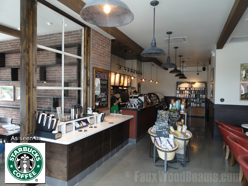 Resawn beams blend perfected with an exposed brick wall, adding a cozy touch to this Montreal Starbucks.