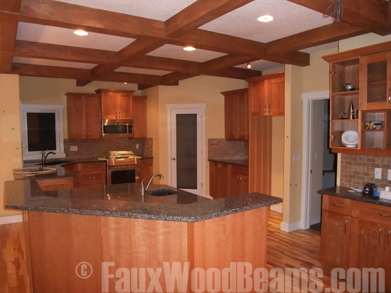 Kitchen with ceiling beams arranged in a grid pattern.