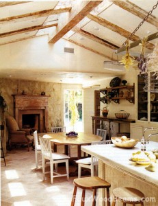 Real reclaimed wood beams add rustic good looks to this sunny kitchen