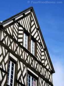 Faux wood planking for the exterior decoration of Tudor revival homes is long lasting and maintenance free.