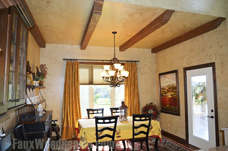 Dining room upgraded with Timber beams is a cozier space.