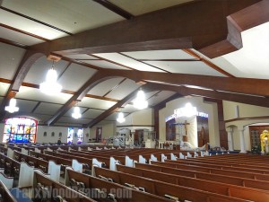 Decorative wooden beams create a beautiful church ceiling design.