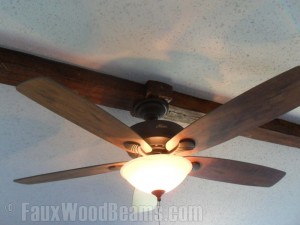 This stippled ceiling appears to have been lightly sanded before the beams were installed.