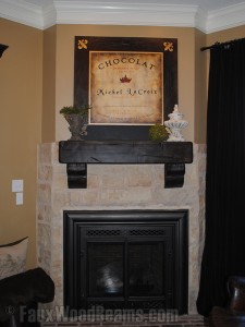 Hand Hewn mantel, custom painted by the homeowner.