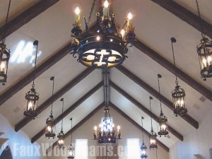 Faux medieval timber beams accentuate the angles of vaulted ceilings.