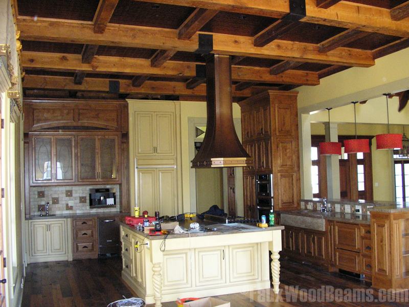 This coffered ceiling design is made with real reclaimed lumber beams.