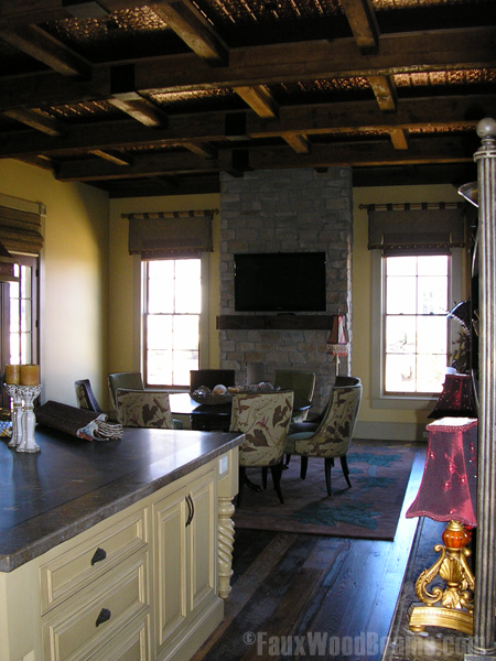 The coffered ceiling in Bill's house is made with our real reclaimed lumber beams.