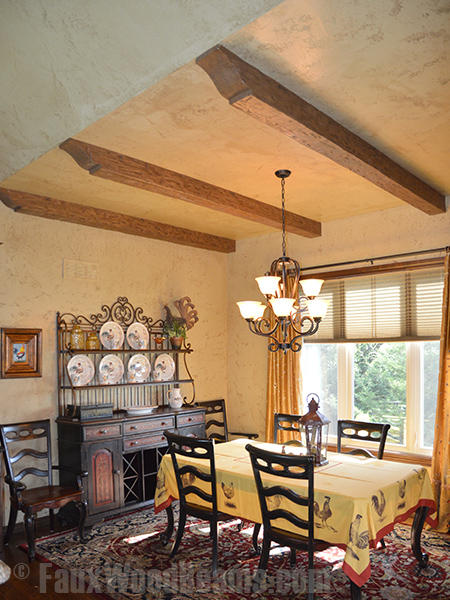 Kelly's dining room with Tuscany beams capped with decorative corbels