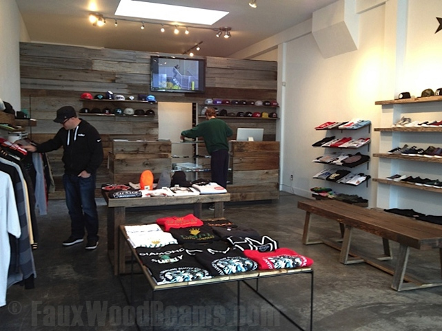 Reclaimed barn board panels add an inviting feel to this retail clothing store.