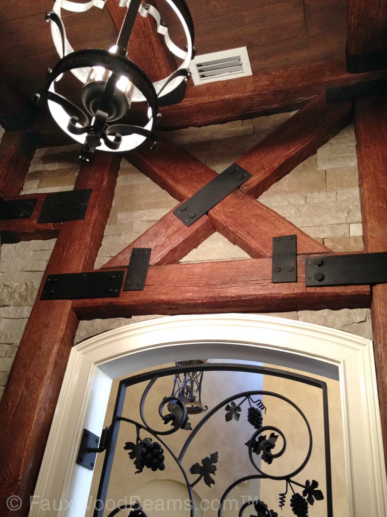 Faux iron connector plates add an authentic look to faux wood beams.