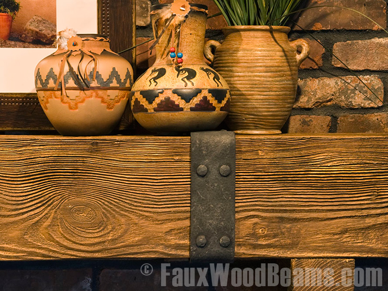 Decorative beam straps are a great way to add a rustic look to mantel designs.
