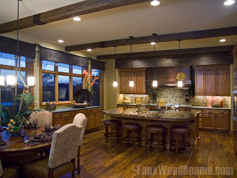 Kitchen ceiling beams with straps added for rustic flair.