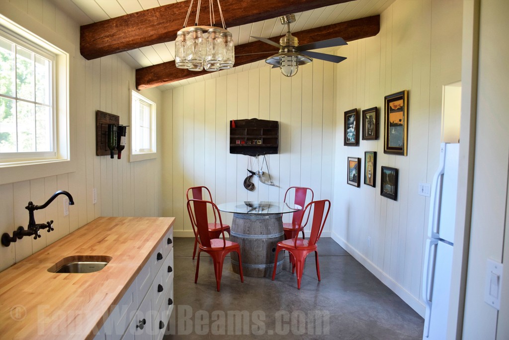 Open floor plan kitchen and dining nook get a cozy new design with Timber beams.