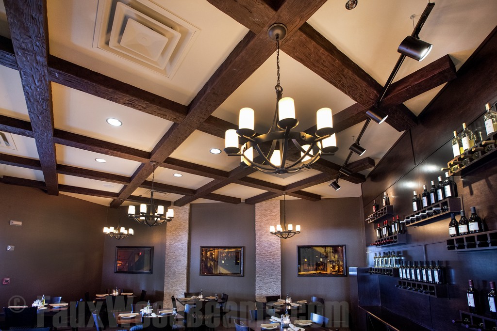 Hanging lights installed on a restaurant's beams