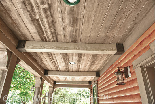 Windswept beams provide welcoming outdoor ceiling decor.