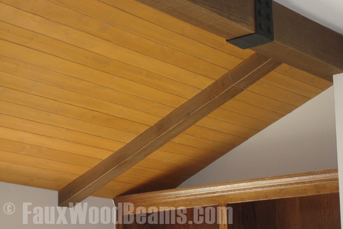 Vaulted ceiling remodeled with planks and beams