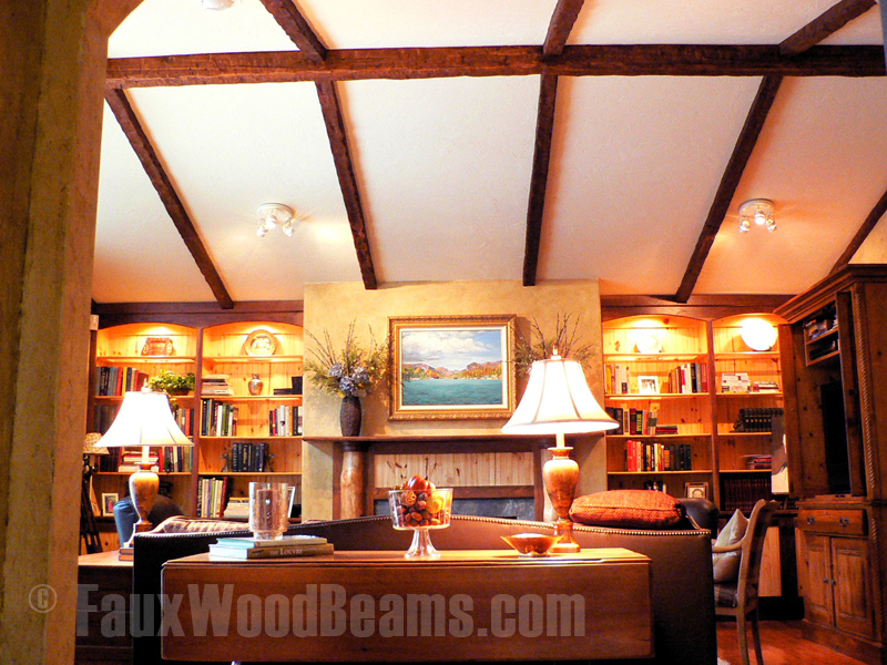 Cozy living room with vaulted ceiling and exposed beams.